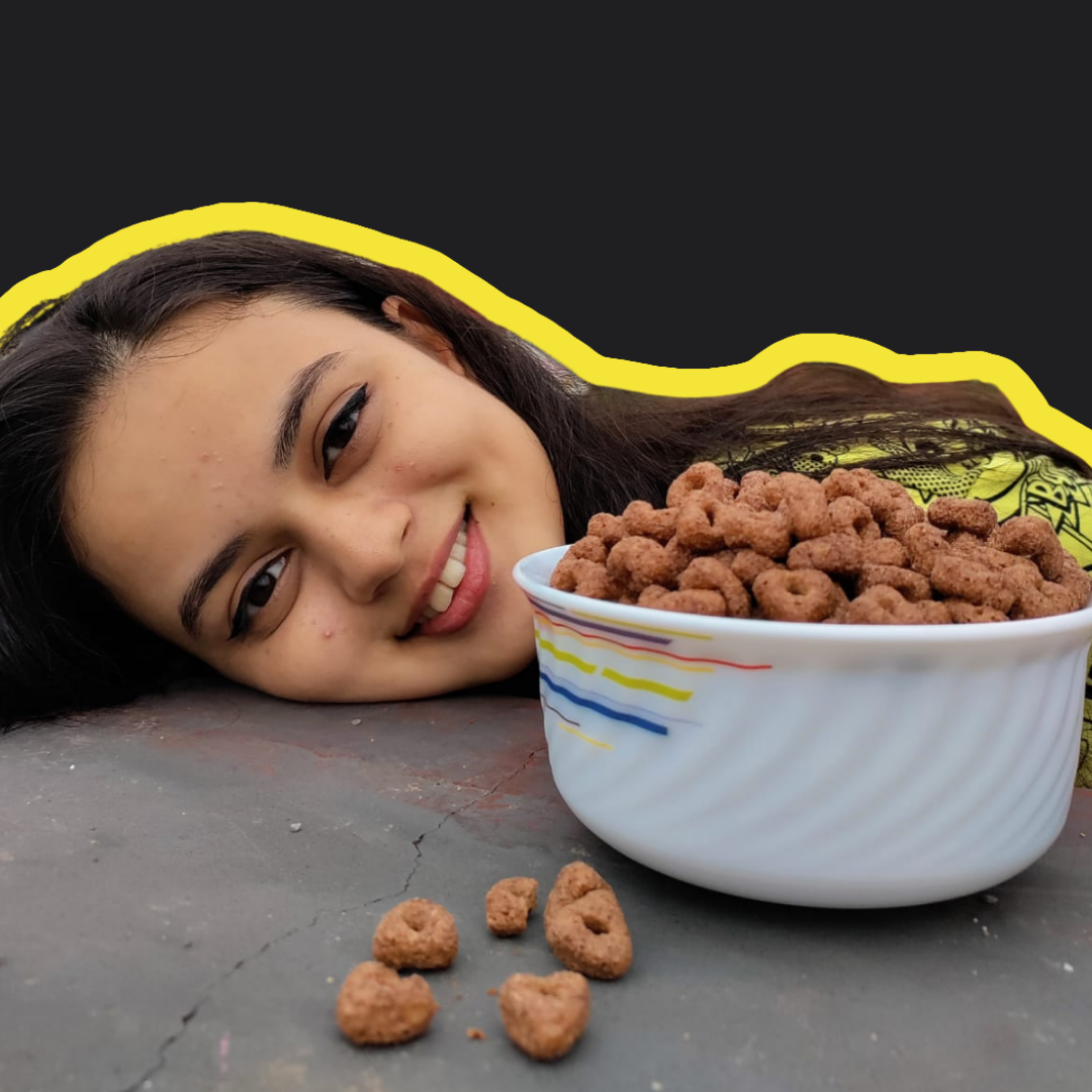 A girl is happy to try out quinoa Choco triangles delicious treat for breakfast with its super healthy and chocolaty flavour